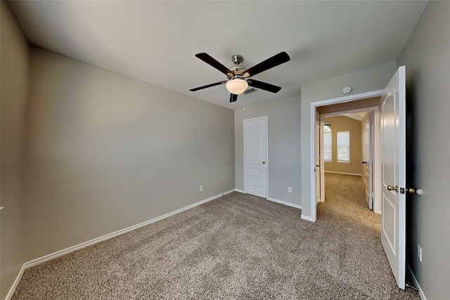 unfurnished bedroom with carpet flooring and ceiling fan