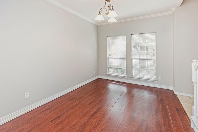 5400 Belle Chasse Ln, Frisco, TX 75035 - unfurnished room with a chandelier, baseboards, wood finished floors, and ornamental molding