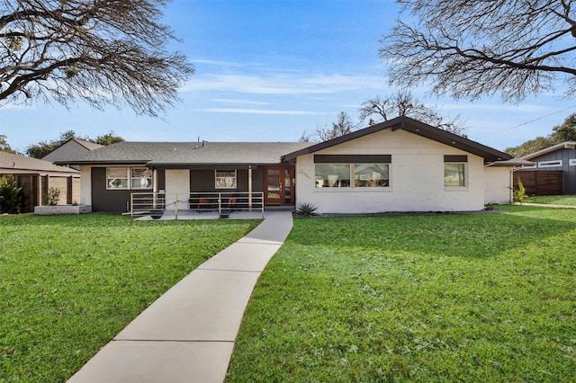 ranch-style house with a patio and a front yard