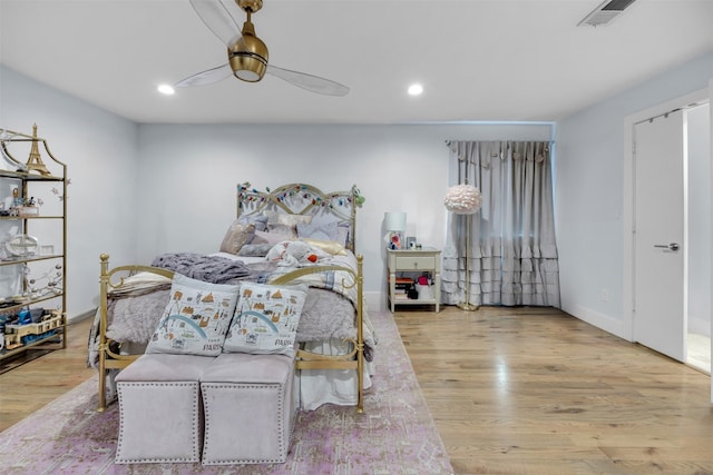 bedroom with ceiling fan and light hardwood / wood-style flooring