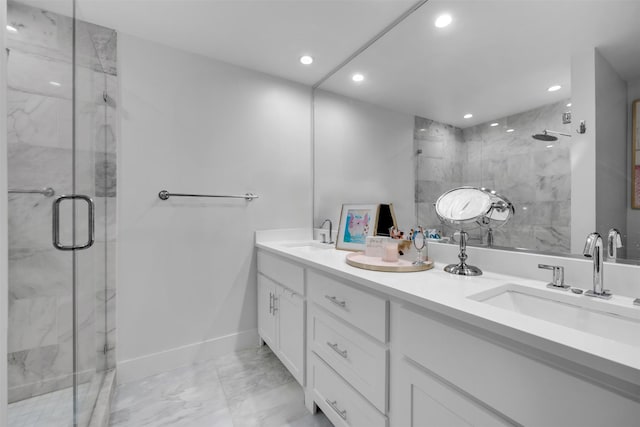 bathroom featuring vanity and an enclosed shower