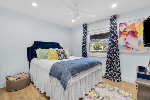 bedroom featuring ceiling fan and hardwood / wood-style floors