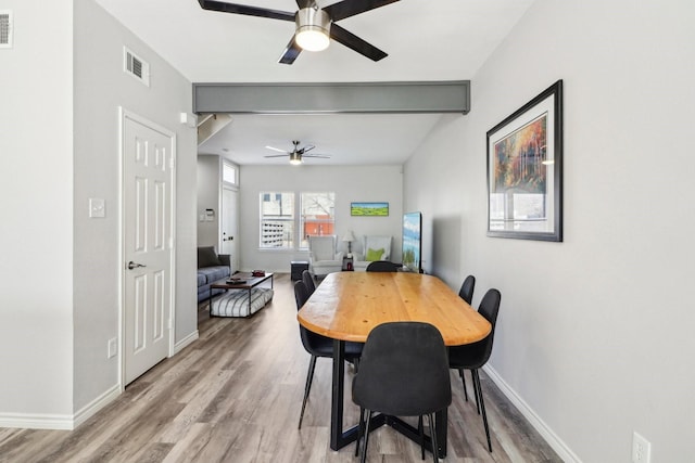 bedroom with ceiling fan, dark wood-type flooring, and vaulted ceiling