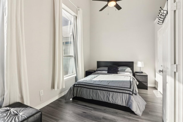 bedroom with ceiling fan and wood-type flooring