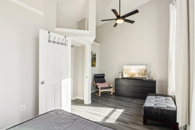 bedroom featuring ceiling fan, hardwood / wood-style floors, and lofted ceiling