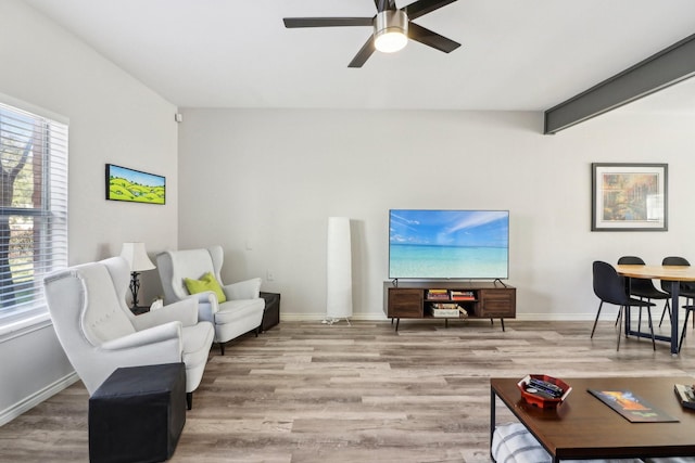 kitchen with white cabinetry, light wood-type flooring, kitchen peninsula, stainless steel appliances, and a breakfast bar area