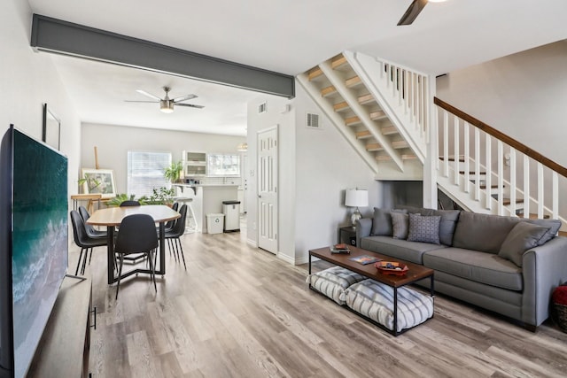 kitchen with pendant lighting, white cabinetry, a breakfast bar area, and appliances with stainless steel finishes