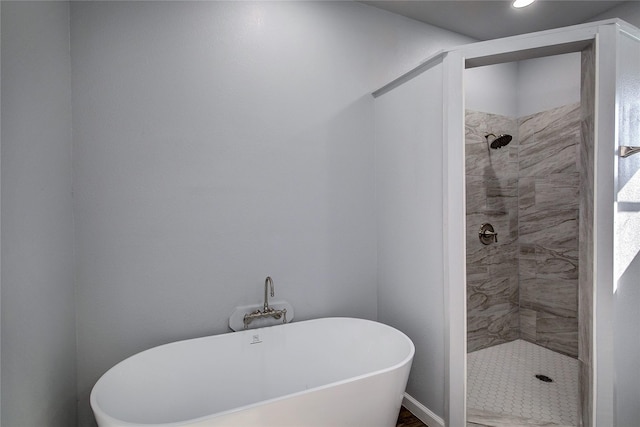 bathroom with shower with separate bathtub