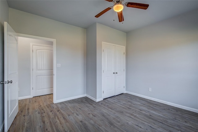 unfurnished bedroom featuring ceiling fan, a closet, and light hardwood / wood-style flooring