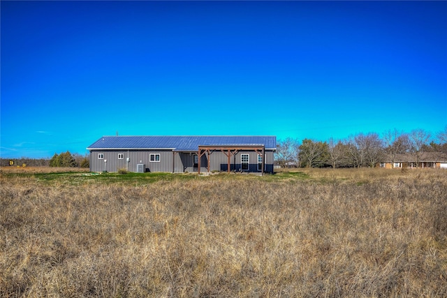 rear view of house with an outbuilding