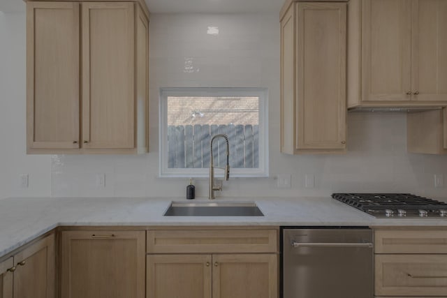 kitchen with light brown cabinetry and sink