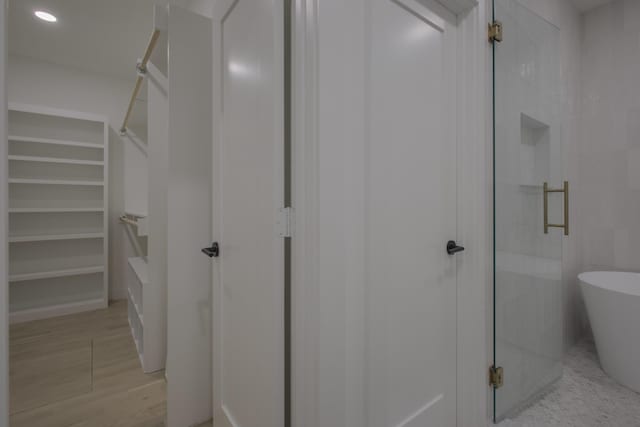 bathroom featuring plus walk in shower