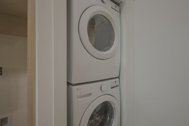 laundry room featuring stacked washing maching and dryer