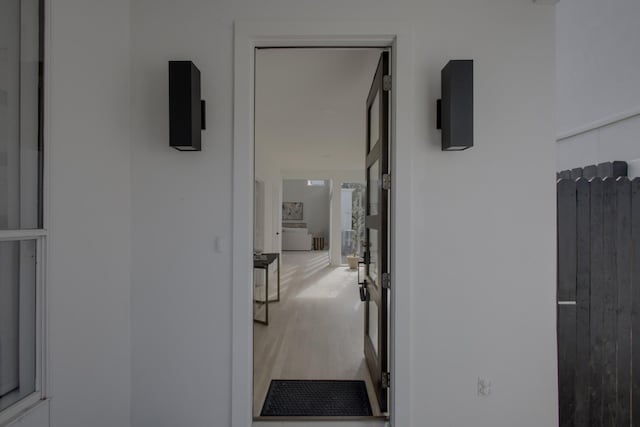 corridor featuring wood-type flooring