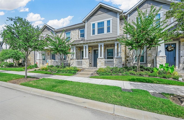 craftsman inspired home featuring covered porch