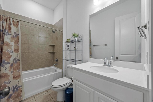 full bathroom with tile patterned floors, vanity, toilet, and shower / tub combo