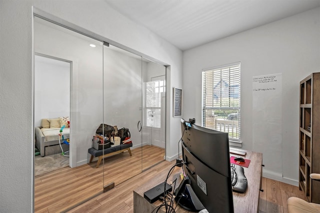 home office with light wood-type flooring