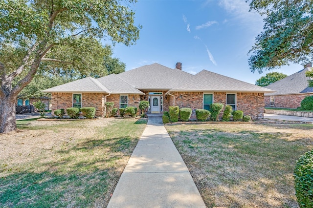 ranch-style home with a front lawn