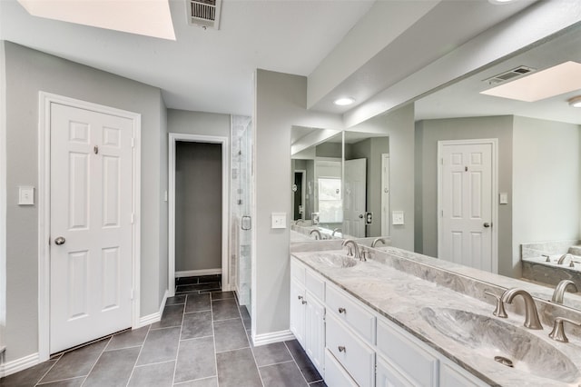 bathroom featuring vanity, tile patterned floors, and separate shower and tub