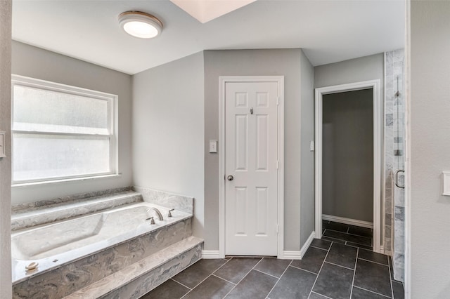 bathroom with tile patterned flooring and plus walk in shower