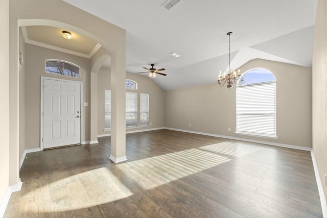 foyer entrance featuring crown molding, ceiling fan with notable chandelier, dark wood-type flooring, and lofted ceiling