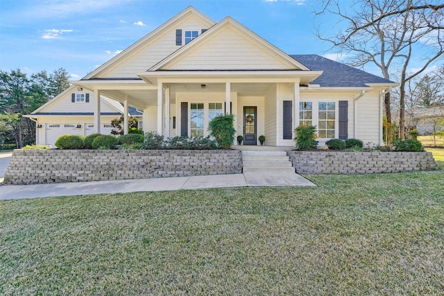 view of front of house with a porch and a front lawn