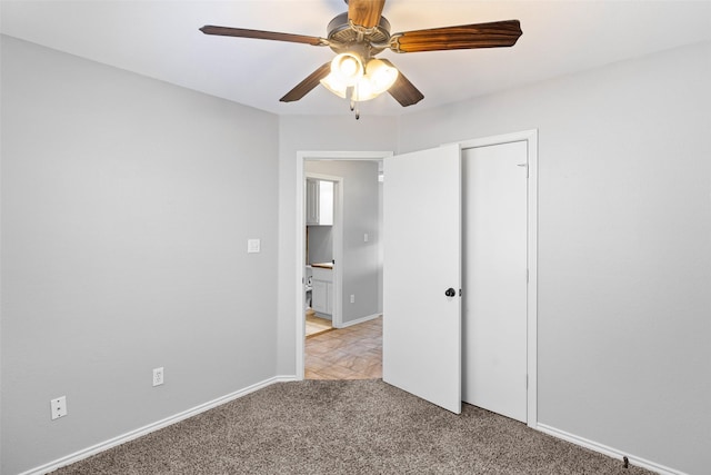 unfurnished bedroom featuring light carpet, a closet, and ceiling fan