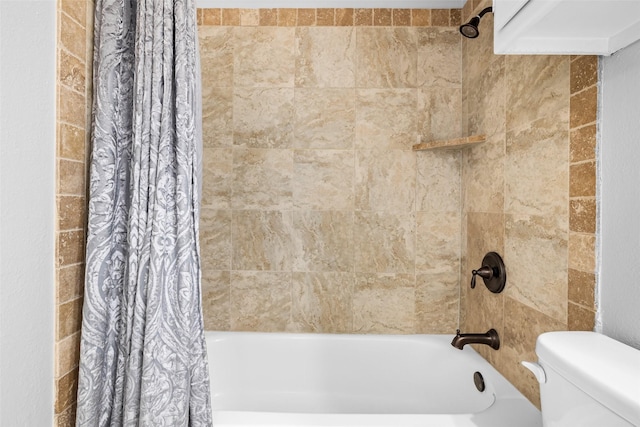 bathroom featuring shower / bath combination with curtain and toilet