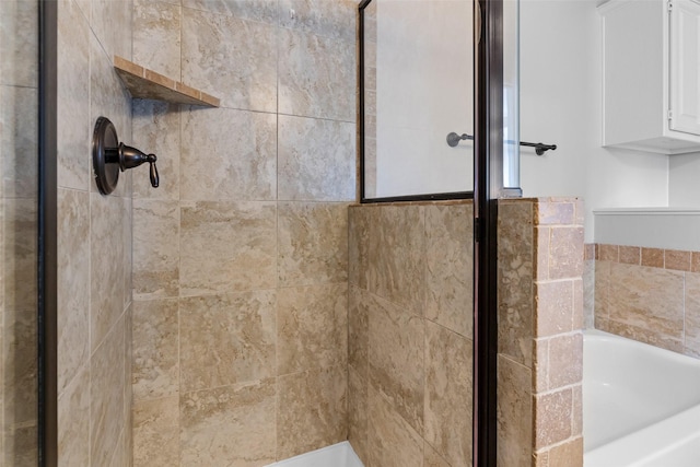 bathroom with shower with separate bathtub