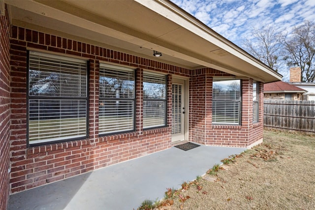 entrance to property with a patio