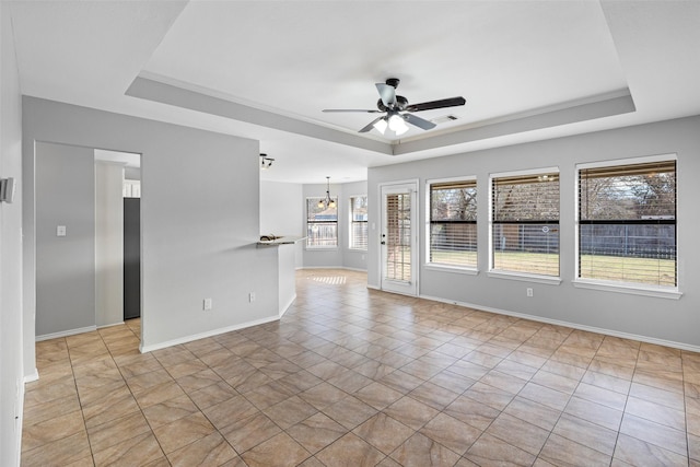 unfurnished room with ceiling fan with notable chandelier, a raised ceiling, and light tile patterned flooring