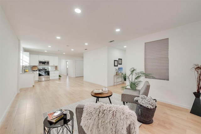 living room with light wood-type flooring