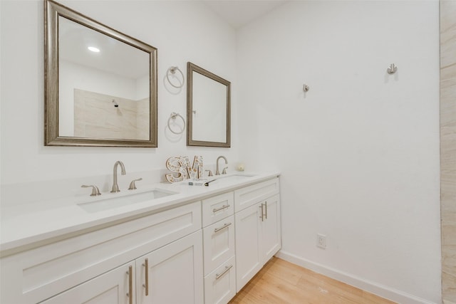 bathroom featuring hardwood / wood-style floors and vanity