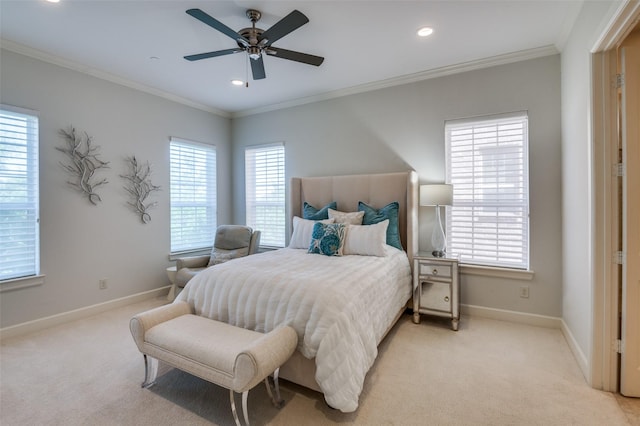 carpeted bedroom featuring ornamental molding and ceiling fan