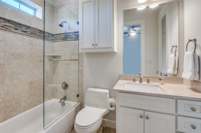 full bathroom with vanity, ceiling fan, tiled shower / bath combo, and toilet