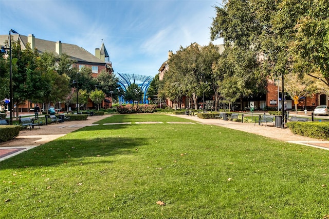 view of property's community featuring a yard