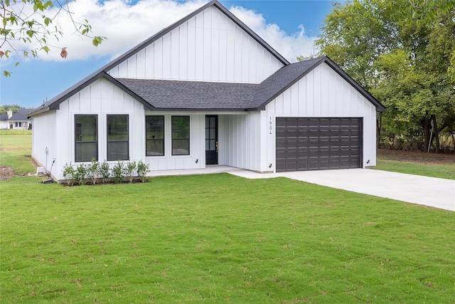 modern inspired farmhouse featuring a front yard and a garage