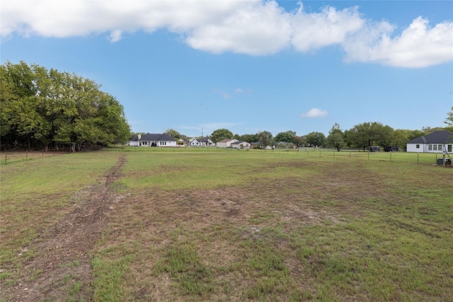 view of yard with a rural view