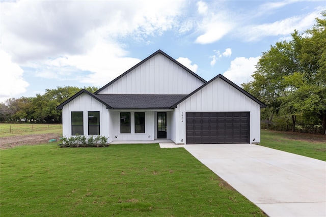 modern farmhouse with a front yard and a garage