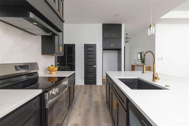 kitchen featuring sink, pendant lighting, extractor fan, stainless steel range with electric cooktop, and light wood-type flooring