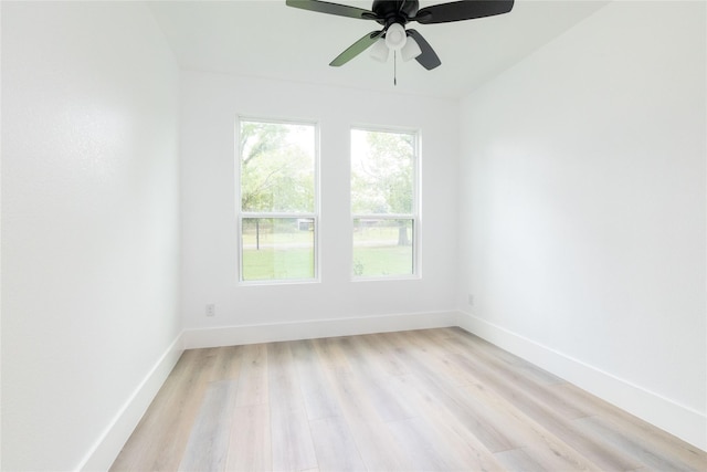 unfurnished room with ceiling fan and light wood-type flooring