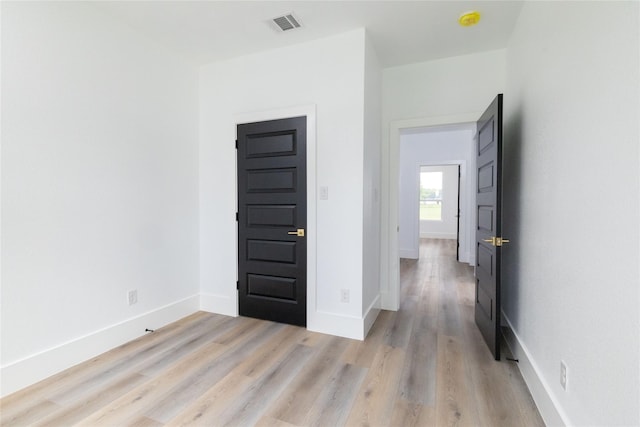 spare room featuring light wood-type flooring