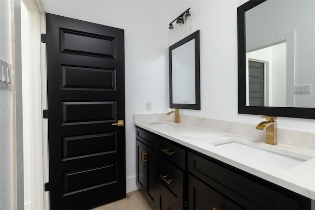 bathroom featuring hardwood / wood-style floors and vanity