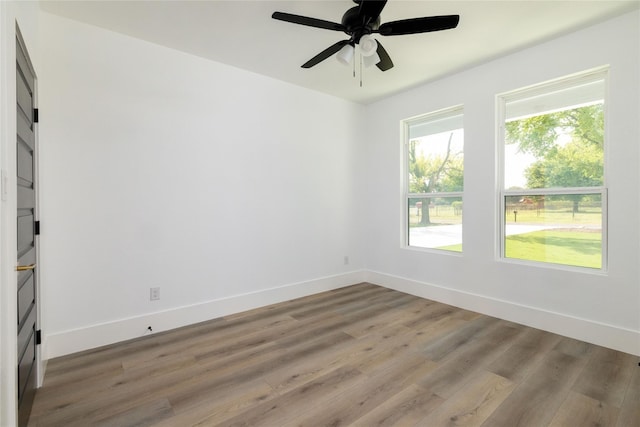 unfurnished room featuring hardwood / wood-style flooring and ceiling fan