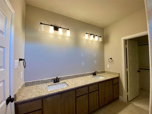 bathroom featuring tile patterned floors and vanity