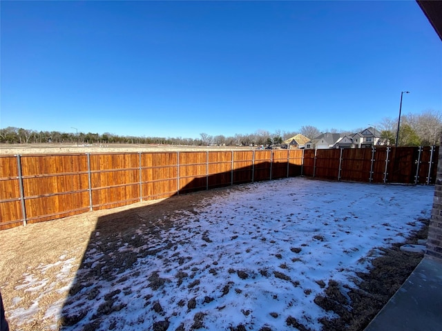 view of yard covered in snow