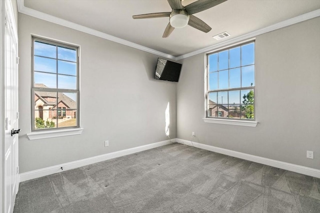 carpeted empty room with crown molding and ceiling fan