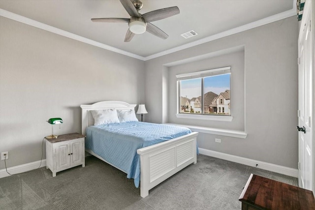 bedroom featuring dark colored carpet, ceiling fan, and crown molding