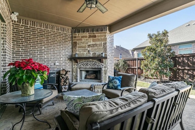 view of patio featuring an outdoor living space with a fireplace