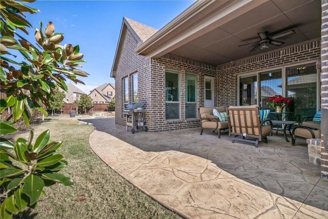 view of patio featuring ceiling fan